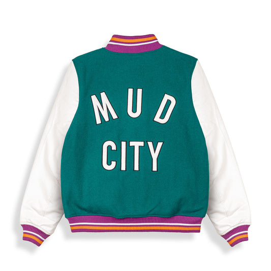 Chaqueta de béisbol Grimey Acknowledge SS20 de color verde, con detalles deportivos y estilo casual visible en la imagen.