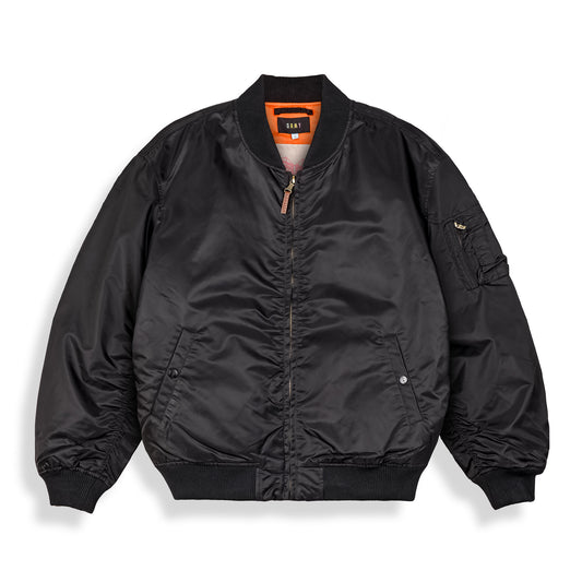 Chaqueta bomber reversible negra de la marca Grimey, estilo casual y moderno, vista en primer plano para temporada primavera 2021.