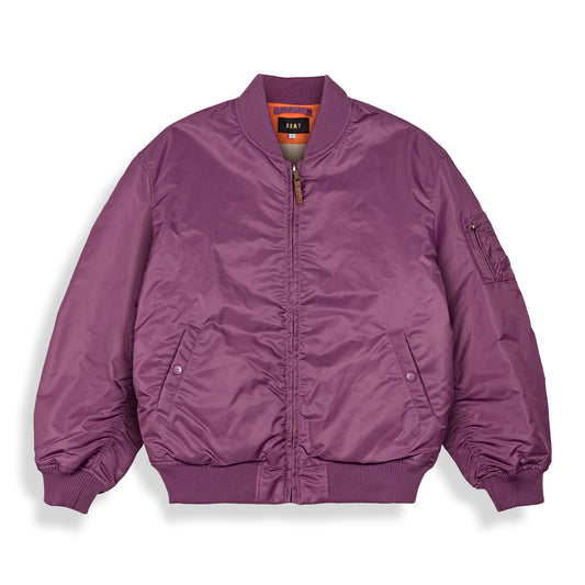 Chaqueta bomber reversible de Grimey en color púrpura, con diseño de primavera y estilo casual.