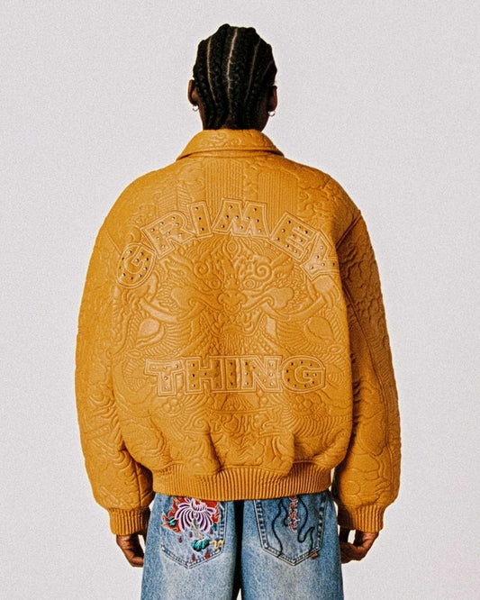 Chaqueta de cuero sintético marrón Hans Island de la marca Grimey, con diseño moderno y detalles en la imagen.