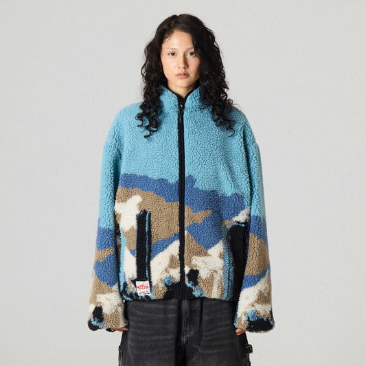 Chaqueta reversible The Props Sherpa negra de la marca Grimey, con diseño acolchado y forro suave en la imagen.
