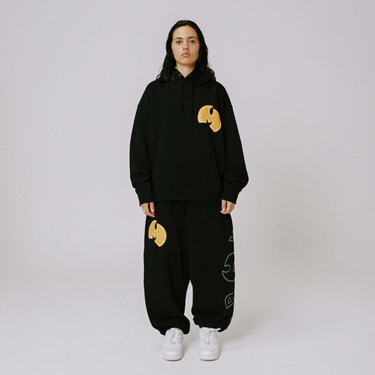Pantalón Tical X Grimey en color negro y amarillo, con diseño urbano y detalles modernos, de la marca Grimey.