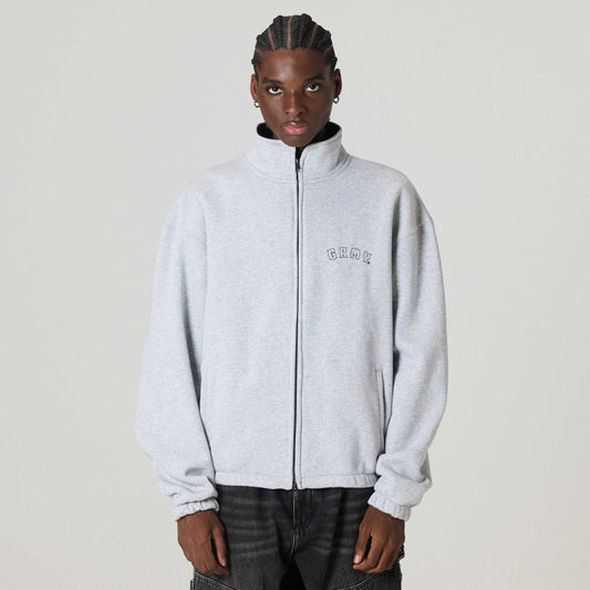 Chaqueta deportiva gris de algodón con cierre en espiral de la marca Grimey, vista frontal en color sport grey.