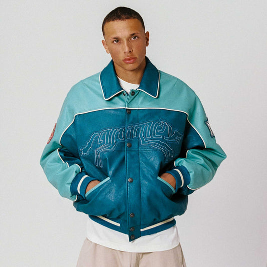 Chaqueta Wild One de Grimey en cuero PU lavado azul, con diseño moderno y detalles en la parte frontal.
