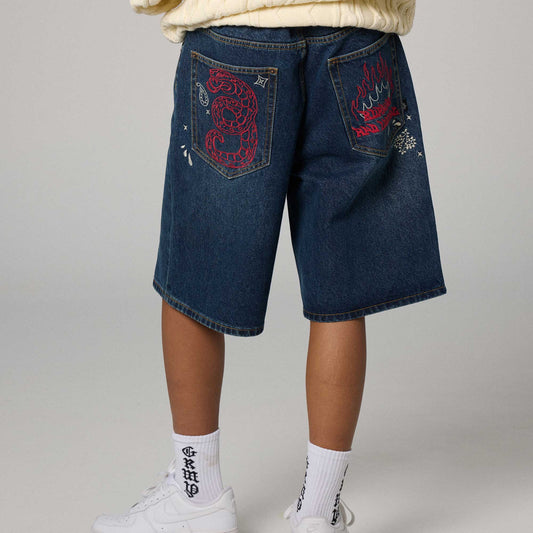 Pantalón corto baggy de color índigo profundo de la marca Grimey, con diseño relajado y bolsillos visibles.