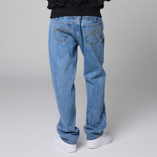 Pantalones vaqueros denim The Planet Grimey de corte regular en azul lavado, con detalles clásicos y ajuste cómodo.