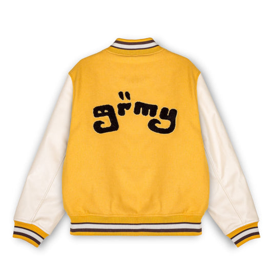 Chaqueta de béisbol Grimey "LUST MANTRA" amarilla para otoño, vista frontal con detalles en color vino.
